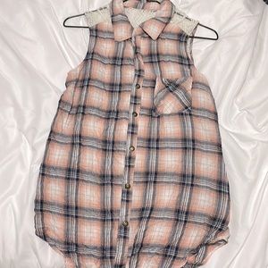 Open back, button up sleeveless shirt